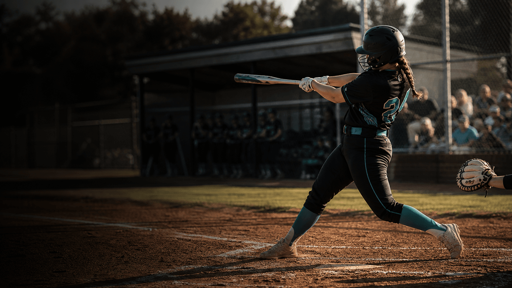 Wranglers softball player swinging during a game